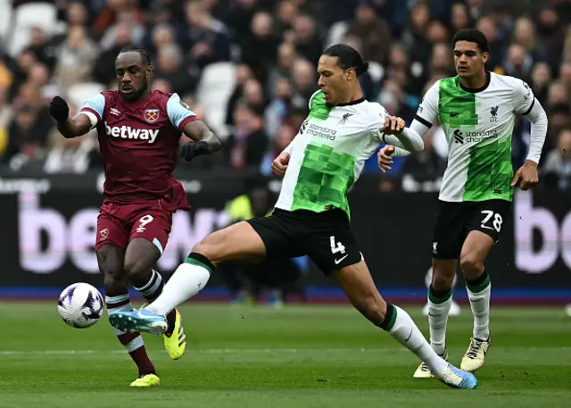 Michail Antonio vies with Liverpool's Dutch defender Virgil van Dijk