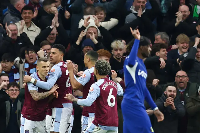 Aston Villa's players celebrate following the own-goal