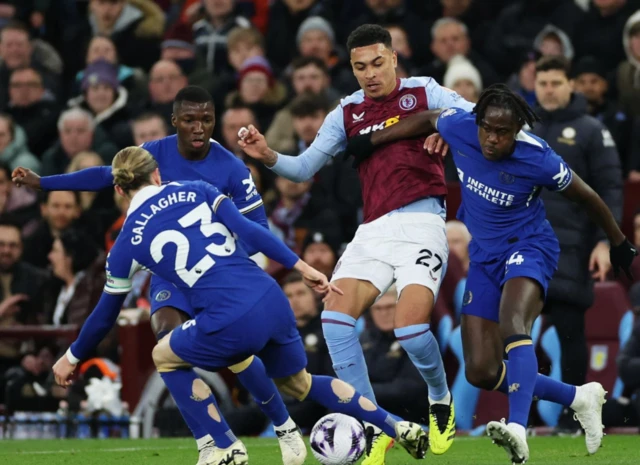 Aston Villa's Morgan Rogers in action with Chelsea's Conor Gallagher