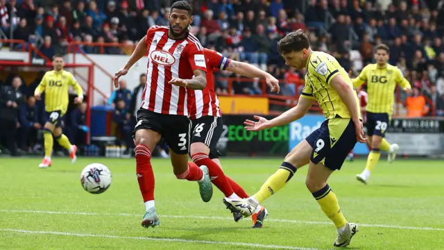 Mark Harris, of Oxford United, scores against Exeter City