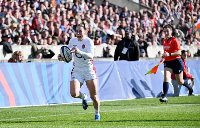 Megan Jones of England breaks with the ball