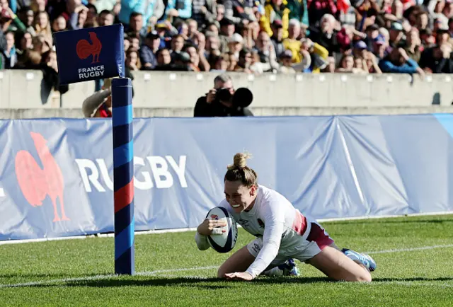 Megan Jones of England scores her team's third try