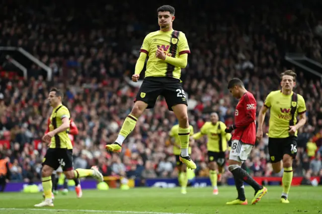 Amdouni celebrates his equaliser at old trafford