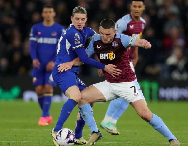 Aston Villa's John McGinn in action with Chelsea's Conor Gallagher