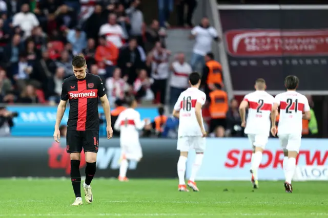 Leverkusen trudge back to kick off after a Stuttgart goal