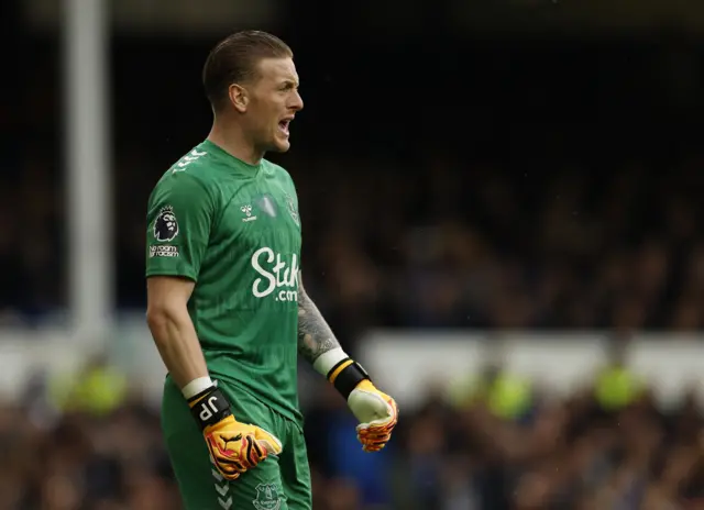 Pickford stands watching the play in his goal