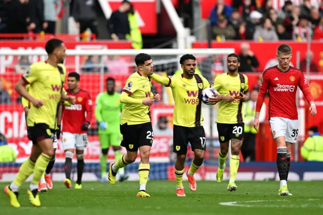 Amdouni carries the ball back to kick off after the equaliser