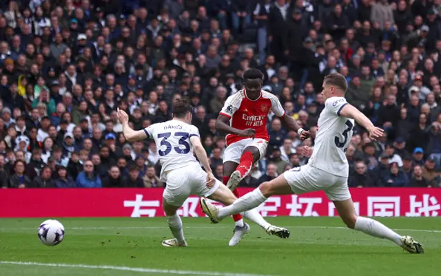 Bukayo Saka of Arsenal scores their teams second goal