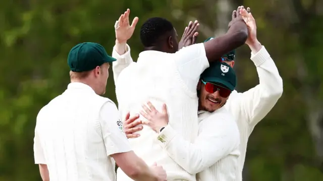 Jason Holder celebrates a wicket