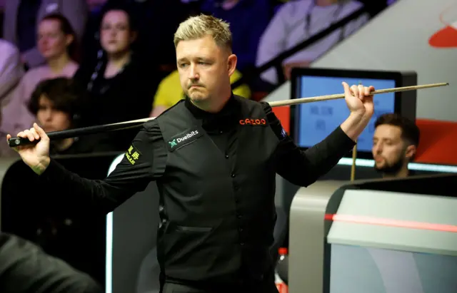 Kyren Wilson with Joe O'Connor in the background