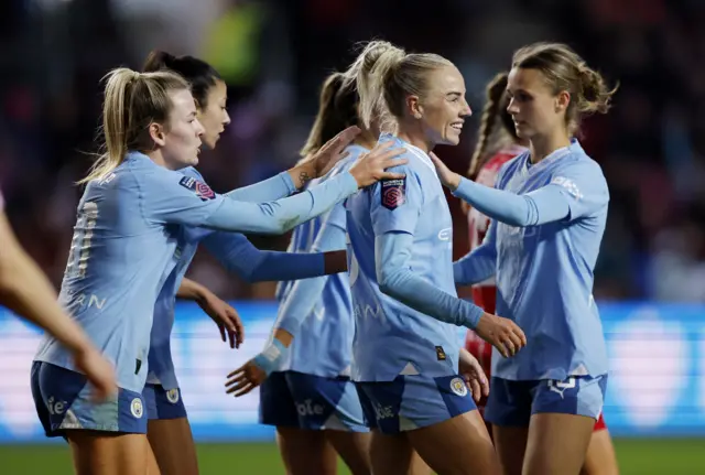 Alex Greenwood celebrates