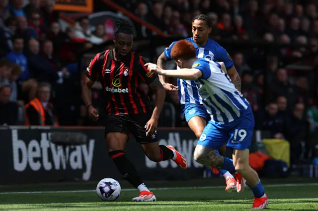 Antoine Semenyo of AFC Bournemouth is challenged by Joao Pedro and Valentin Barco