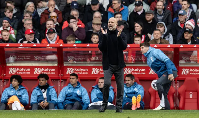 Manchester City's Pep Guardiola applauds on the touchline