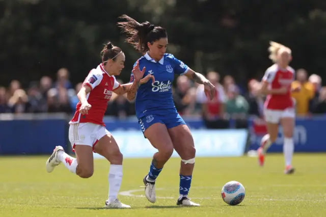 Martina Piemonte of Everton is challenged by Caitlin Foord of Arsenal