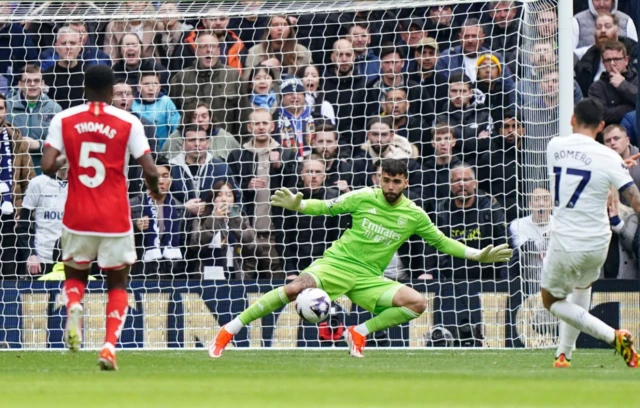 Cristian Romero beats Arsenal goalkeeper David Raya to score their first goal of the gam