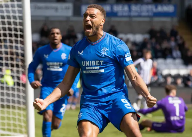 Rangers' Cyriel Dessers celebrates after making it 2-1 during a cinch Premiership match between St Mirren and Rangers at SMiSA Stadium, on April 28, 2024, in Paisley, Scotland.