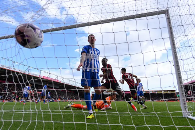 Lewis Dunk of Brighton kicks the ball into the net in frustration