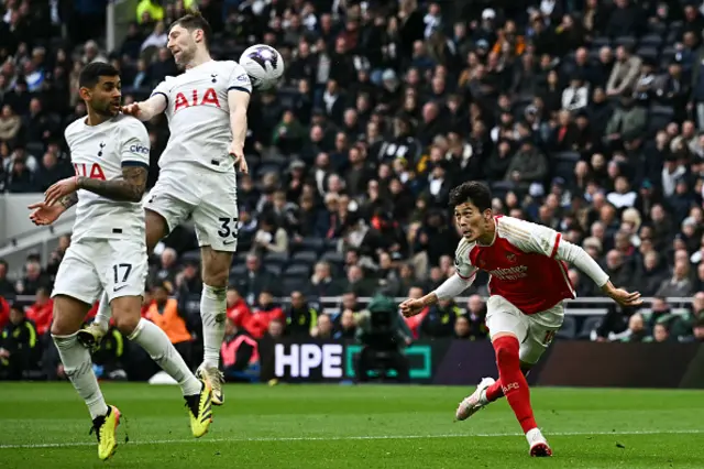 Takehiro Tomiyasu heads the ball