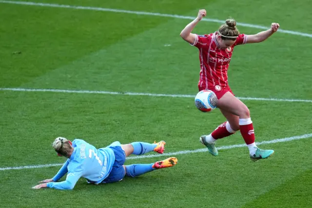 Bristol City's Emily Syme (right) is challenged by Manchester City's Laura Coombs during the Barclays Women's Super League match at Ashton Gate, Bristol.