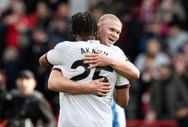 Manchester City's Erling Haaland (right) celebrates victory at the end