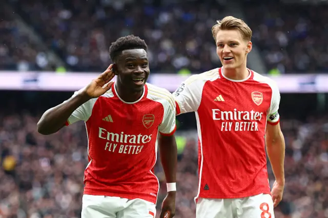 Bukayo Saka and Martin Odegaard of Arsenal celebrate