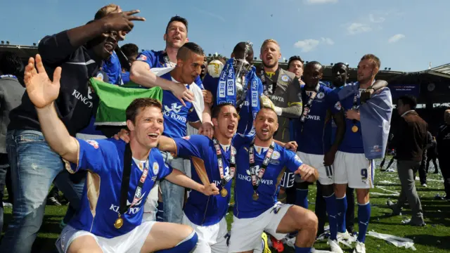 Leicester players celebrate the 2013/14 title