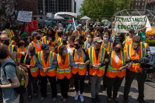 Faculty of Columbia University link arms to protect students inside threatened with suspension if they refused to voluntarily dismantle the pro-Palestine encampment on campus by 2 pm on April 29, 2024