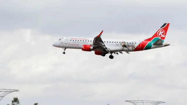 A Kenya Airways passenger Embraer 190 plane manoeuvres at the Kenya Defence Forces (KDF) Museum Air Show Festival in conjunction with the Aero Club at the Uhuru Gardens in Nairobi, Kenya, May 28, 2022.