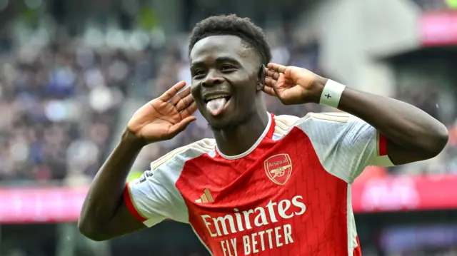 Bukayo Saka celebrates