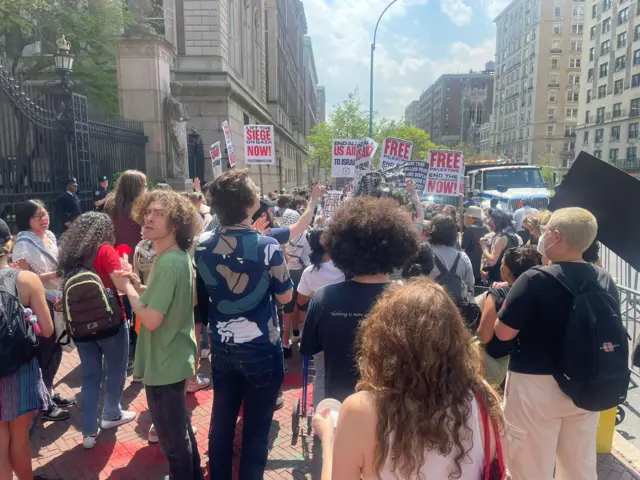 Students gather with signs that say "Free Palestine".