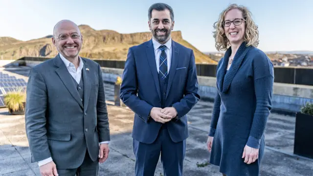 SNP leader and First Minister Humza Yousaf poses with Scottish Greens co-leaders Patrick Harvie and Lorna Slater