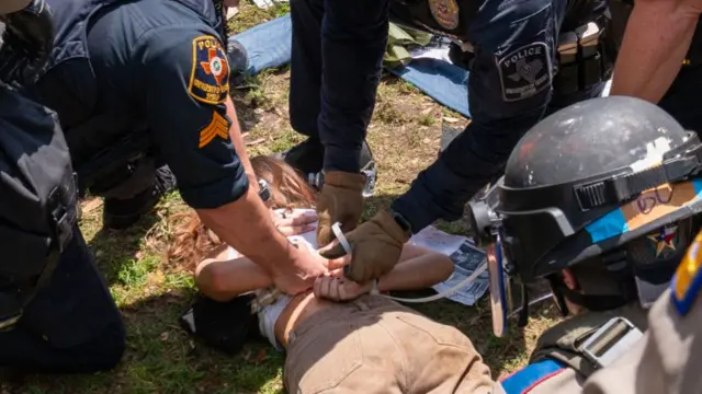 Demonstrator arrested by Texas State troopers and university police at University of Texas in Austin