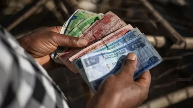 A person holding Ethiopian birr