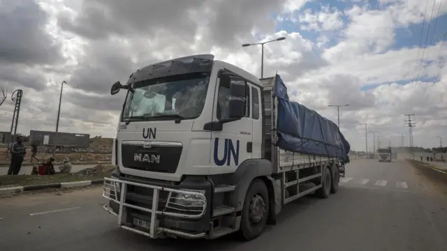 Trucks carrying aid to Gaza residents cross from Rafah border to Deir Al Balah town