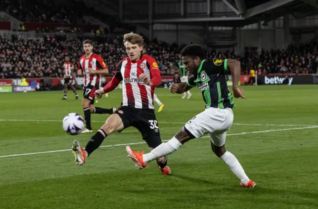 Lamptey tries to cross into the box as Roerslev covers