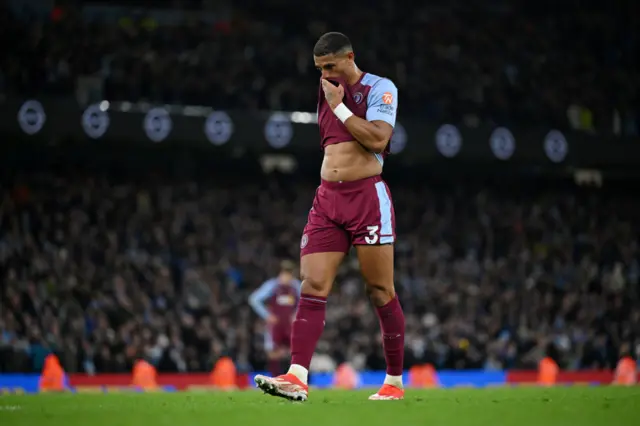 Carlos wipes his face in frustration.