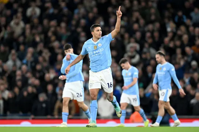 Rodri celebrates his goal v Villa