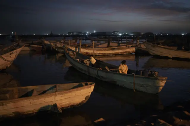 Boats at a harbour at night