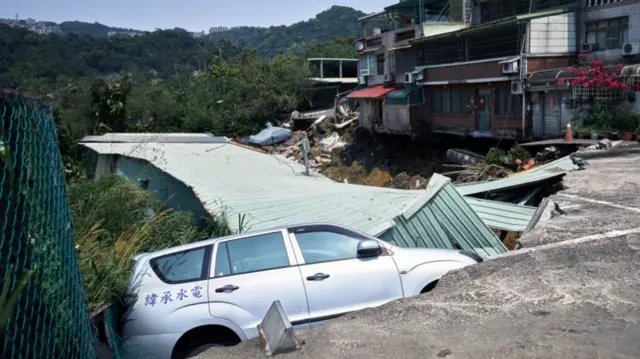 A vehicle in a collapsed road following an earthquake in Taiwan