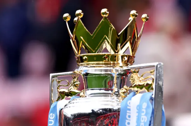 PL trophy with Man City blue ribbons