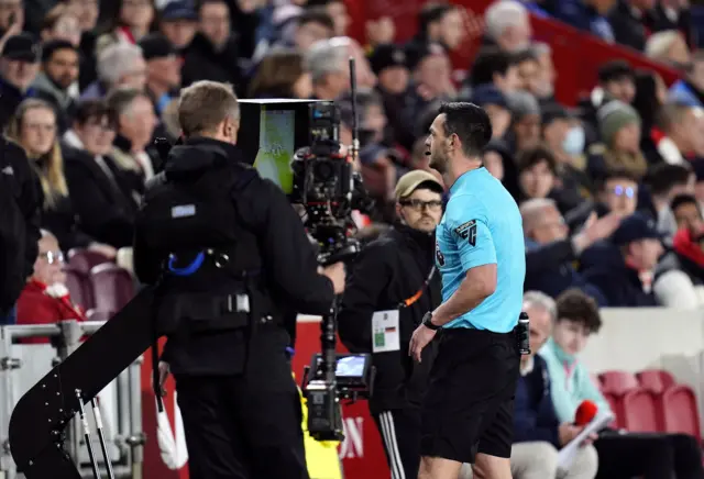 Ref looks at VAR screen