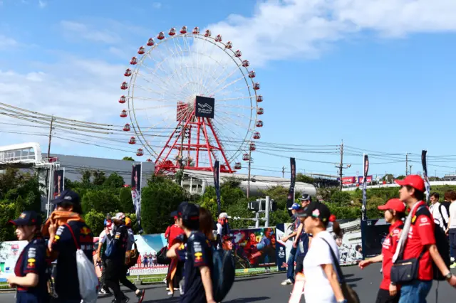 Fans walk around the Suzuka circuit