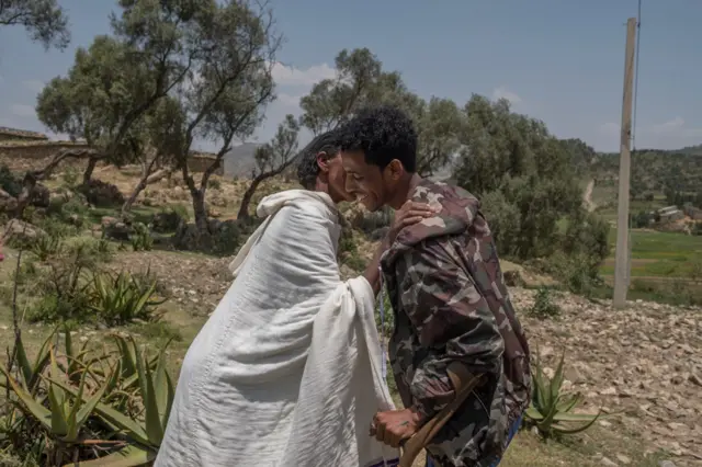 Tigray Defense Forces soldier Kibrom Berhane greets his mother