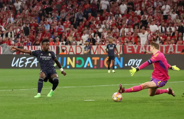 Vinicius scores past Neuer to give Madrid the lead