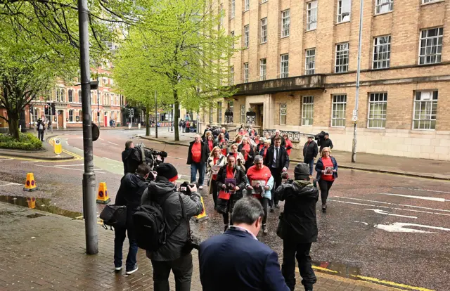 Families walking to inquiry venue