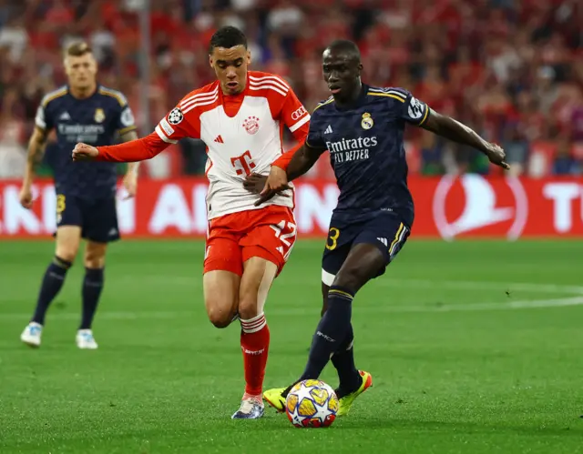 Mendy dribbles away from Musiala