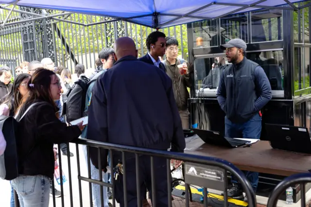 People check in with security to enter Columbia University on April 30, 2024 in New York City