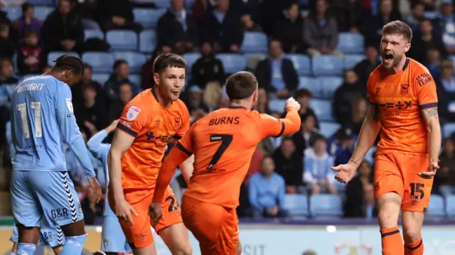 Ipswich celebrate Cameron Burgess' goal at Coventry