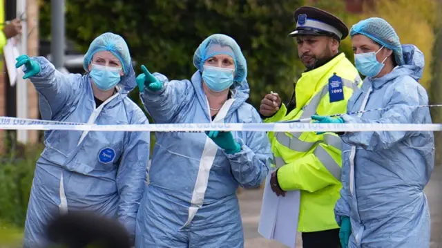 Forensic investigators in Laing Close in Hainault, north east London