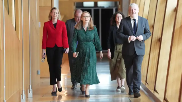 Cabinet Secretary for Education and Skills Jenny Gilruth, Cabinet Secretary for Communities, Social Security and Equalities Shirley-Anne Somerville and SNP MSP Angus Robertson arrive at the Scottish Parliament.